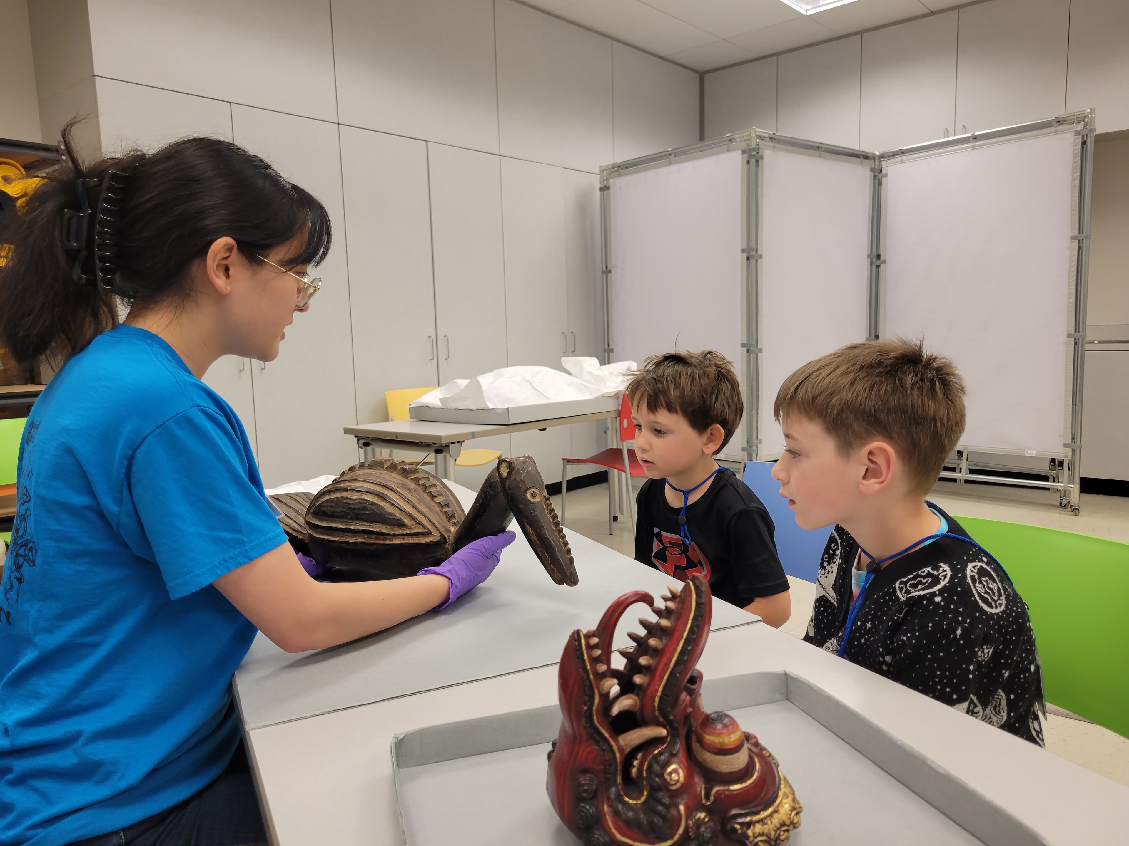 Students examining artworks in an Art to Go program