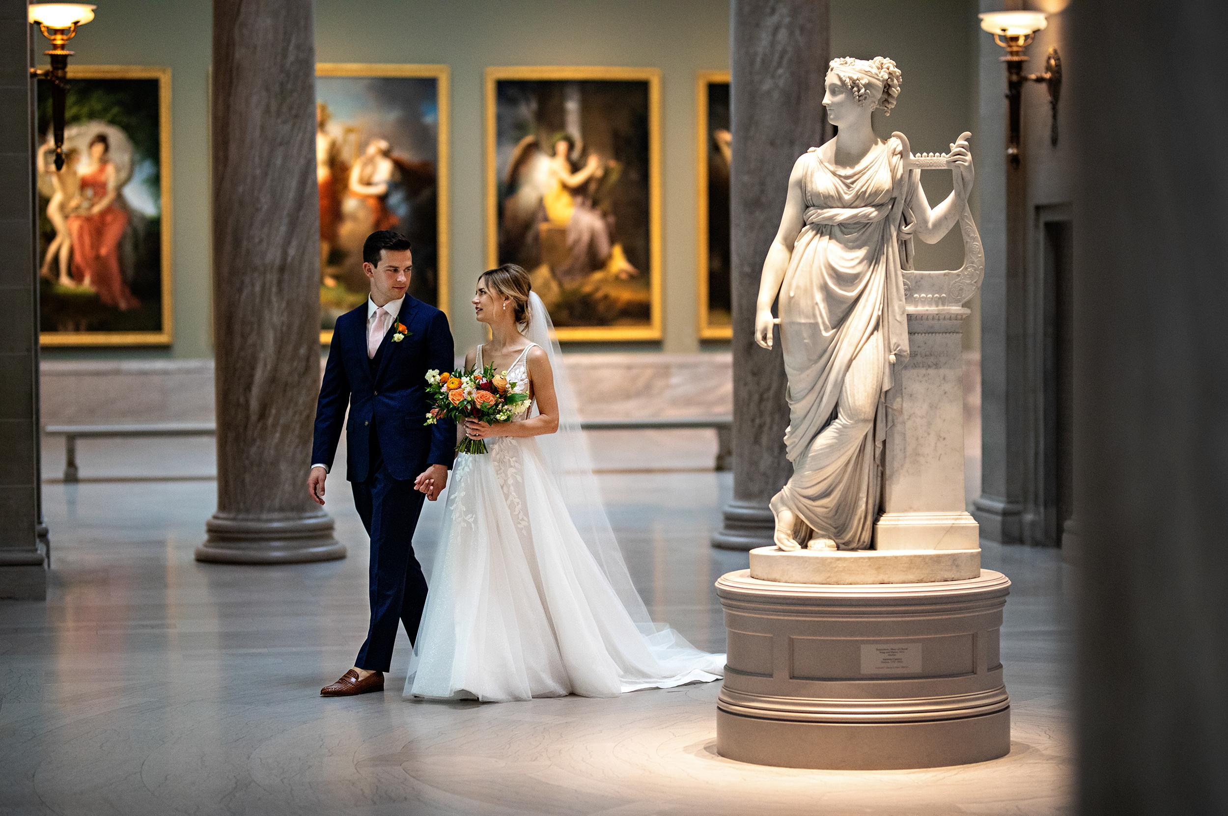 Wedding Couple walking through gallery